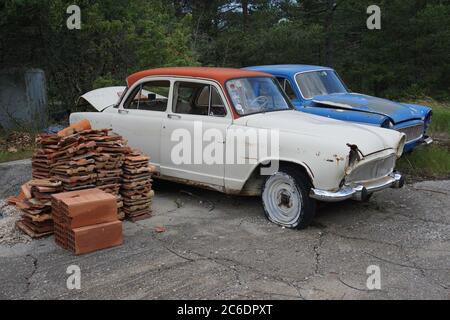 two old vintage french cars abandoned in the mountains Stock Photo