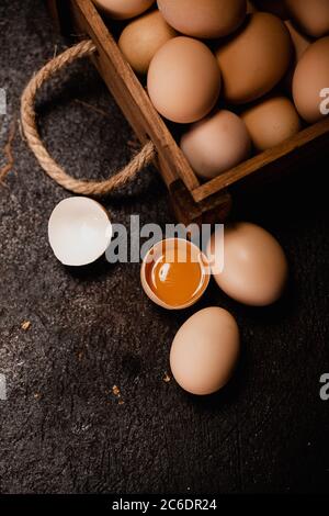 Fresh chicken eggs in carton egg tray or wood boxes Stock Photo