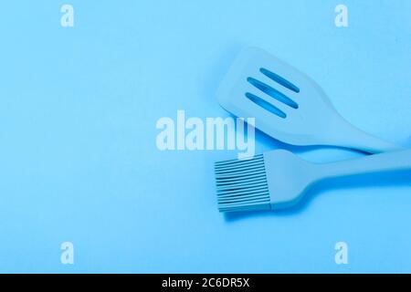 different kitchenware on a blue background top view. Stock Photo
