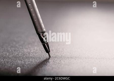 automatic plastic ballpoint pen with clipping path on black background. close up. Stock Photo