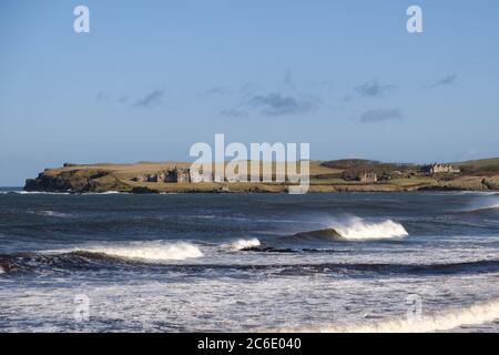 View across the sea from Runkerry beach near Portballintrae in County Antrim, towards the Giants Causeway and the Causeway Coast Stock Photo