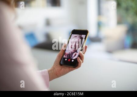 Happy women video chatting with smart phone Stock Photo