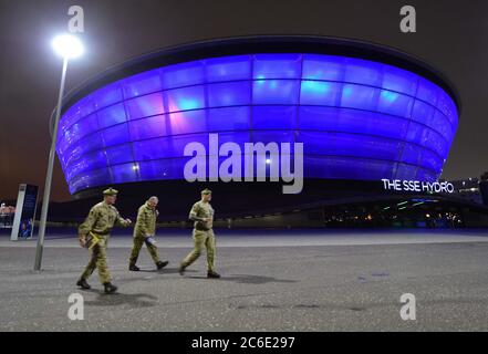 The army leave Glasgow's SEC tonight in the shadow of the Hydro lit up blue to say Thank You to the NHS.British Army is helping convert Glasgow's SEC Centre into a temporary NHS hospital as part of the UK's response to the coronavirus outbreak.  Speaking at the Scottish Government headquarters in Edinburgh, Scotland's First Minister Nicola Sturgeon said the venue could be operational within a fortnight and will initially have 300 beds. Stock Photo