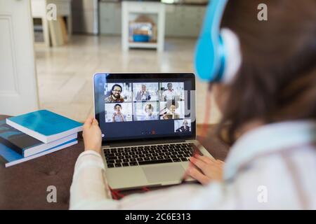 Colleagues video chatting on laptop screen Stock Photo