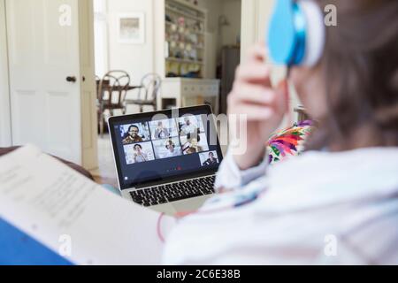 Colleagues video chatting on laptop screen Stock Photo