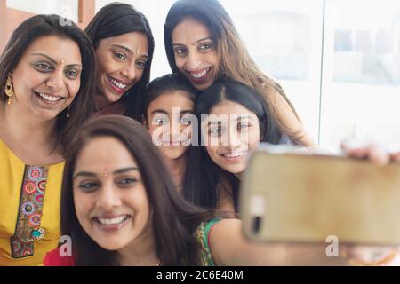 Happy Indian women and girls with binds taking selfie Stock Photo