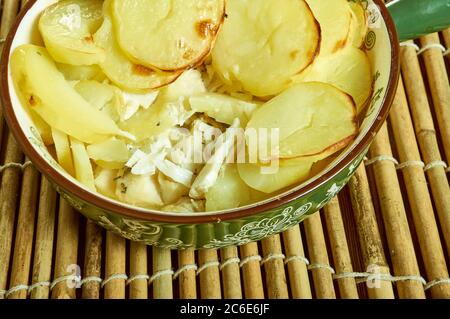 Scalloped Potato And Smoked Fish Pot, Smoked haddock and potato gratin Stock Photo