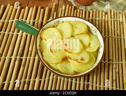 Scalloped Potato And Smoked Fish Pot, Smoked haddock and potato gratin Stock Photo