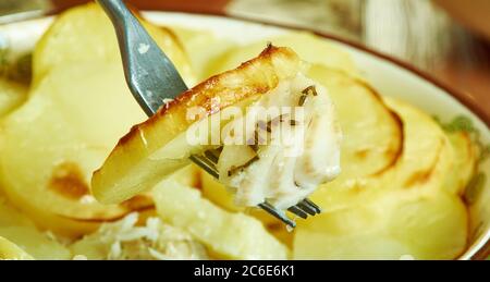 Scalloped Potato And Smoked Fish Pot, Smoked haddock and potato gratin Stock Photo