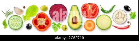 Isolated vegetable halves. Raw cut vegetables top view (beetroot, zucchini, carrot, avocado, bell pepper, cucumber, eggplant, tomato, spices and herbs Stock Photo