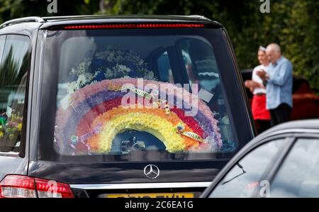 A rainbow floral tribute in one of the hearses in the funeral procession of Fiona Gibson, 12, Alexander James Gibson, eight, and five-year-old Philip Gibson, the three children who died in a house fire in Paisley, Renfrewshire on June 19. Stock Photo