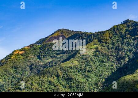 the serene view of hills in the valley of Kampung Kiau, Bundu Tuhan Stock Photo