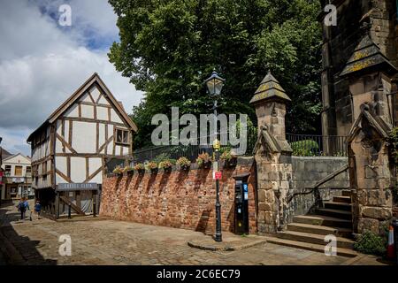 Shrewsbury town centre in Shropshire  Grade II Listed St Alkmund's Church entrance and Bear Steps Cafe Stock Photo