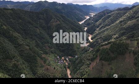 Huangshan. 9th July, 2020. Aerial photo taken on July 9, 2020 shows a view of Qiashe Township in Huizhou District of Huangshan City, east China's Anhui Province. Heavy rainfall hit the Huizhou District of Huangshan City, leaving several villages inundated in varying degrees. The local authorities rapidly organized flood response efforts to evacuate effected residents, rehabilitate destroyed roads and dredge silt-clogged ditches. Credit: Zhou Mu/Xinhua/Alamy Live News Stock Photo