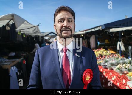 Afzal Khan, Labour's candidate in the Manchester Gorton by-election, launches his campaign at Longsight Market in Manchester. The by-election was trig Stock Photo