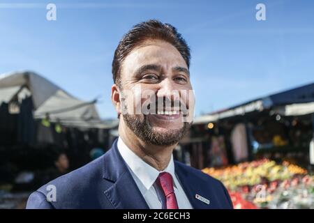 Afzal Khan, Labour's candidate in the Manchester Gorton by-election, launches his campaign at Longsight Market in Manchester. The by-election was trig Stock Photo