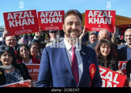 Afzal Khan, Labour's candidate in the Manchester Gorton by-election, launches his campaign at Longsight Market in Manchester. The by-election was trig Stock Photo