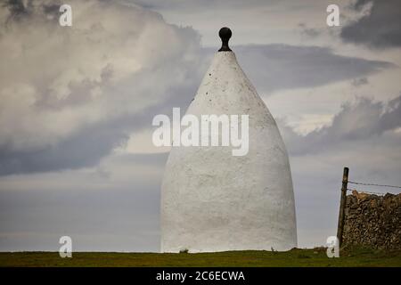 Bollington town in Cheshire  Grade II listed landmark White Nancy  structure at the top of Kerridge Hill originally a summer house or a folly by 1817 Stock Photo