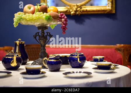 Old porcelain tea set on the table. Stock Photo