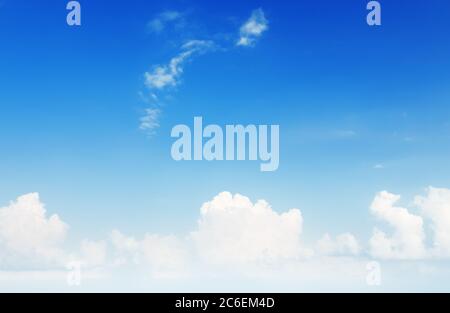 Blue sky background with white tiny clouds. Blue and white pastel heaven background. Stock Photo