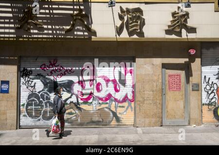 Closed business with graffiti in Chinatown, New York City. Stock Photo