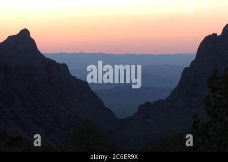 Big Bend National Park USA, March, 2005: Sunset view through 'The Window' looking out from The Basin area in the Chisos Mountains of Big Bend National Park in far west Texas. ©Bob Daemmrich Stock Photo