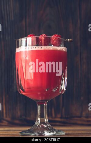 Glass of Clover Club Cocktail on wooden background Stock Photo