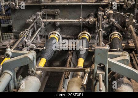 spindles for thread and use in looms Stock Photo