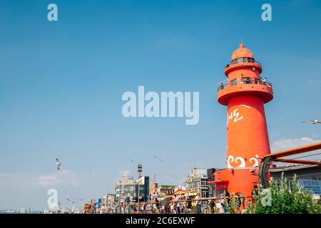 Siheung, Korea - July 9, 2020 : Oido red lighthouse and seaside restaurants Stock Photo