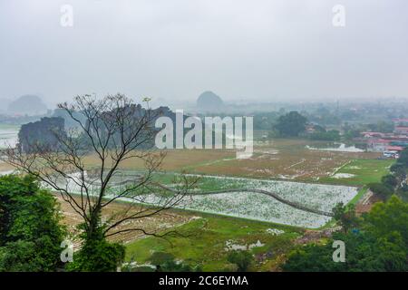 Landscape of Tam Coc during heavy rain, Vietnam Stock Photo