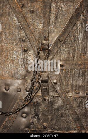 Very old dungeon door in medieval castle Stock Photo