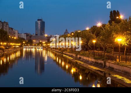 Bucharest on Dambovita river, Romania in a summer night Stock Photo