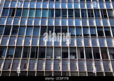 Weathered windows modern city office building Stock Photo