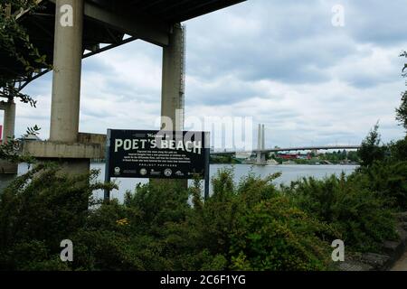 Sign at Poet's Beach, beneath Marquam Bridge near the Waterfront District and downtown Portland, Oregon; Willamette River. Stock Photo