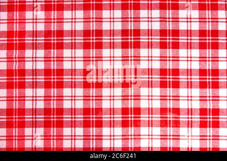 Red checkered tablecloth fabric background texture, close-up. Stock Photo