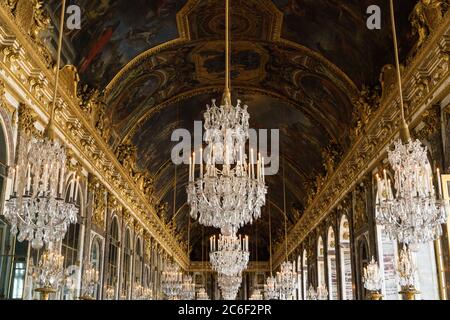 Chandeliers of the palace of versailles in the hall of mirrors Stock Photo