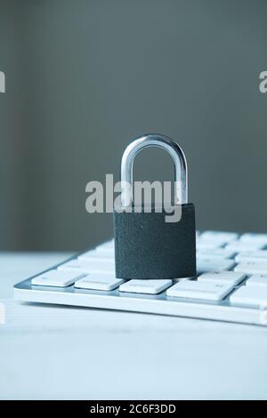 internet safety concept with padlocked on computer keyboard Stock Photo