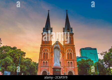 Ho Chi Minh city (Saigon), Vietnam - 09 July 2020: Saigon Notre-Dame Cathedral Basilica (Basilica of Our Lady of The Immaculate Conception) on blue sk Stock Photo