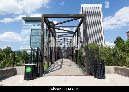 RICHMOND, VIRGINIA - August 8, 2019: a footbridge crosses the James River canal going to Brown's Island Stock Photo