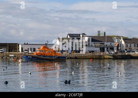 RNLI Lifeboat in Portrush Harbour. In background, Portrush Yacht Club. Stock Photo