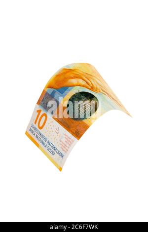 Flying Swiss money - 10 francs note isolated with clipping path Stock Photo