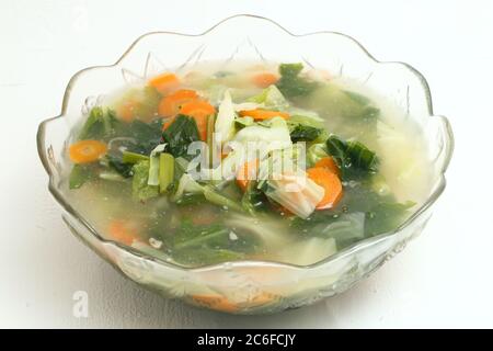 Sayur Bening Bayam or Spinach Clear Soup on white background. Stock Photo