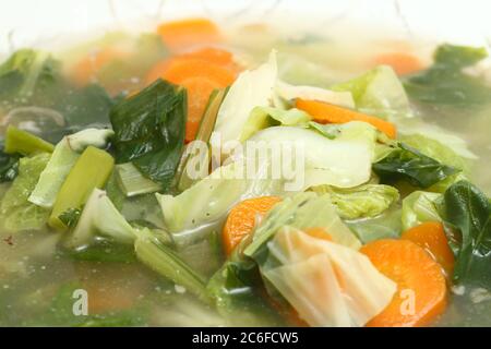 Sayur Bening Bayam or Spinach Clear Soup on white background. Stock Photo