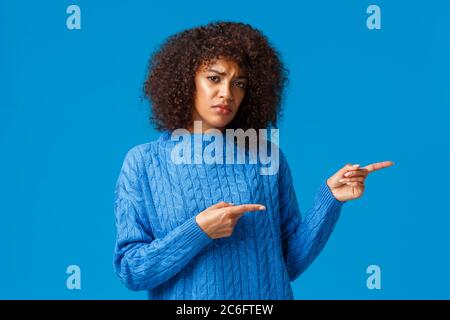 Unhappy gloomy and sulking cute african-american woman feeling displeased and sad about bad delivery service, spoilt christmas and new year holidays Stock Photo