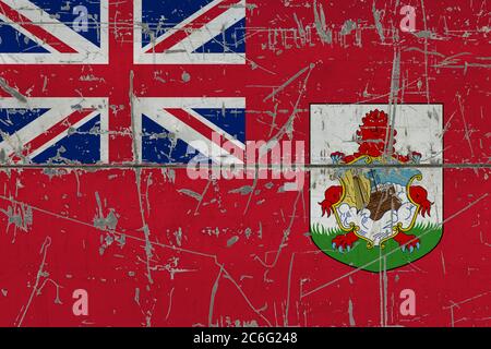 Bermuda flag painted on cracked dirty surface. National pattern on vintage style surface. Scratched and weathered concept. Stock Photo