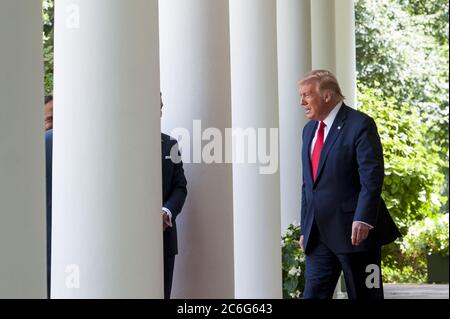 Washington, United States. 09th July, 2020. U.S. President Donald Trump walks along the West Wing colonnade before making remarks about an Executive Order on 'The White House Hispanic Prosperity Initiative' in the Rose Garden of The White House in Washington, DC., Thursday, July 9, 2020. Photo by Rod Lamkey/UPI Credit: UPI/Alamy Live News Stock Photo