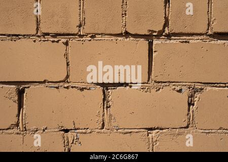bricks of orange color close-up, solid wall, textured stone Stock Photo