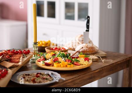 beautiful and bright food stands on a wooden table, stylish bright kitchen Stock Photo