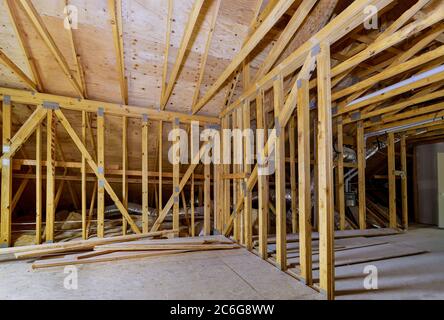 Frame walls beam built framework frame house attic under construction interior inside Stock Photo