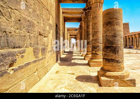 Colonnade in the courtyard in the Philae Temple of Isis on Agilkia island in Aswan Stock Photo